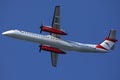 Austrian Airlines small jet flying up in the sky Royalty Free Stock Photo