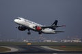 Austrian Airlines Star Alliance plane landing in airport Royalty Free Stock Photo