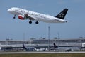 Austrian Airlines Star Alliance plane taking off from runway Royalty Free Stock Photo