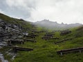 Austrian Alps on the Grossglockner with wooden avalanche barriers Royalty Free Stock Photo