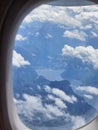 Austrian Alps lake seen from the window of a plane Royalty Free Stock Photo