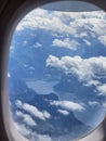 Austrian Alps lake seen from the window of a plane Royalty Free Stock Photo