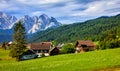 Austrian Alps Mountains. Alpine Village. Foggy clouds on trees Royalty Free Stock Photo