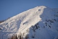 Austrian Alps peak with winter snow and ski tracks Royalty Free Stock Photo