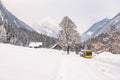 Austrian bus and wooden house. Mountains at the background. Ski region Schladming-Dachstein, Liezen District, Styria, Austria Royalty Free Stock Photo