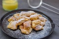 Austrian cuisine. Torn pancake or omelet kaiserschmarrn with honey, powdered sugar