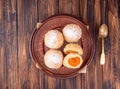 Austrian and czech sweet dessert knedle apricot dumplings on gray concrete background. Filled cottage cheese dough. top view