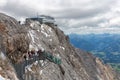 Austrian Dachstein Mountains with hikers passing a skywalk rope bridge Royalty Free Stock Photo