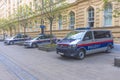 Austrian federal police cars parked on the street in front of the police headquarters in the old city center of Graz, Austria