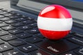 Austrian flag on laptop keyboard. Online business, education, shopping in Austria concept. 3D rendering