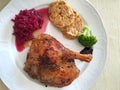 Austrian food, Roasted Duck with steamed bread dumplings Serviettenknoedel and red cabbage Royalty Free Stock Photo