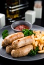 austrian grilled sausages with french fries are a traditional snack Royalty Free Stock Photo