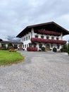 Austrian house on the background of the Alps Royalty Free Stock Photo