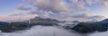 Austrian mountain chain in reutte with colorful sunset clouds and ground fog