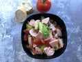 Austrian sausage salad `Wurstsalat` is a traditional snack and a light summer dish