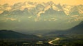 Austrian and Swiss mountains with snow and hilly small town Royalty Free Stock Photo