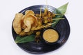 Authentic Asiatic street food chicken satay with peanut sauce and shrimps crackers Royalty Free Stock Photo