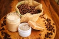 Soap, cream and scrub and coffee beans in burlap sack