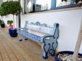 Authentic bench decorated with ceramic tiles of blue and white colour outside in the shade of the yard in Carvoeiro, Portugal