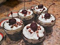 Authentic Black Forest Cake Baked in Mason Jars with Kirsh, Whipped Cream, and a Cherry