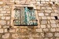 Texture of stone wall with part of wooden green shutters, background Royalty Free Stock Photo