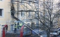 Fire brigade working after fire in an appartment, Royalty Free Stock Photo