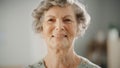 Authentic Close Up Portrait of Senior Female Pensioner in a Bright Room at Home. Beautiful Old Royalty Free Stock Photo