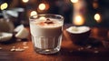 Authentic Coquito or Coconut Eggnog in glass beaker. Christmas Latin American drink. Close-up