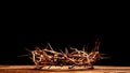 A crown of thorns on a wooden background. Easter Theme Royalty Free Stock Photo