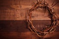 A crown of thorns on a wooden background. Easter Theme Royalty Free Stock Photo