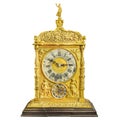 Authentic eighteenth century golden table clock isolated on a white background