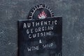 Authentic Georgian cuisine and wine shop black signage chalkboard with hand-drawn chalk letters