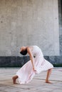 Authentic girl dancing on the street barefoot