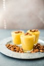 Authentic Indian cold drink made up of curd, milk malai called Lassi in saffron, kesar flavour, also called kesariya or keshariya Royalty Free Stock Photo