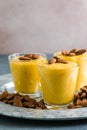 Authentic Indian cold drink made up of curd, milk malai called Lassi in saffron, kesar flavour, also called kesariya or keshariya Royalty Free Stock Photo