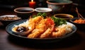 Authentic Japanese cuisine tempura shrimp with traditional sides and dipping sauce served on a ceramic plate Royalty Free Stock Photo