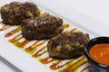 authentic mediterranean arabic cuisine, juicy beef or lamb meat and cheese kebab with spiced red harissa sauce