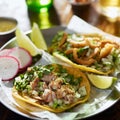 Authentic mexican street tacos with chopped pork, cilantro and onion