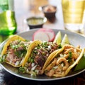 Authentic mexican street tacos on plate with beef and pork