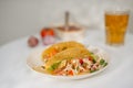 Authentic mexican tacos with beer. Mexican tacos with ground meat, beef, beans, onions and salsa Royalty Free Stock Photo