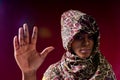 authentic mixed race arabian woman in leopard silk veil scarf hijab showing no hands sign Royalty Free Stock Photo