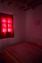 Authentic Moroccan bedroom in traditional riad with red light