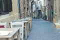 Authentic narrow colorful mediterranean street in the Chania town at the dusk. Island of Crete Royalty Free Stock Photo