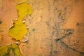 Authentic old style industrial background. Close-up of a dirty part of an old road roller. Orange colored metal Royalty Free Stock Photo