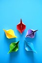 Authentic Origami Boats In Circle On Blue Background