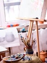 Authentic paint brushes still life on table in art class school. Royalty Free Stock Photo