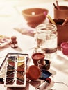 Authentic paint brushes still life on table in art class school. Royalty Free Stock Photo