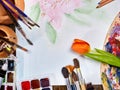 Authentic paint brushes still life on table in art class school. Royalty Free Stock Photo