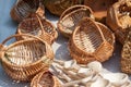 Authentic pile of handmade retro rustic craft wicker basket and wooden spoons market stall