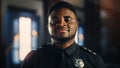 Authentic Portrait of Happy and Handsome Black Policeman in Universal Uniform Smiling at Camera Royalty Free Stock Photo